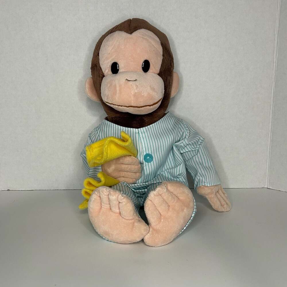 Curious George Plush Toy in Striped Pajamas with Yellow Blanket